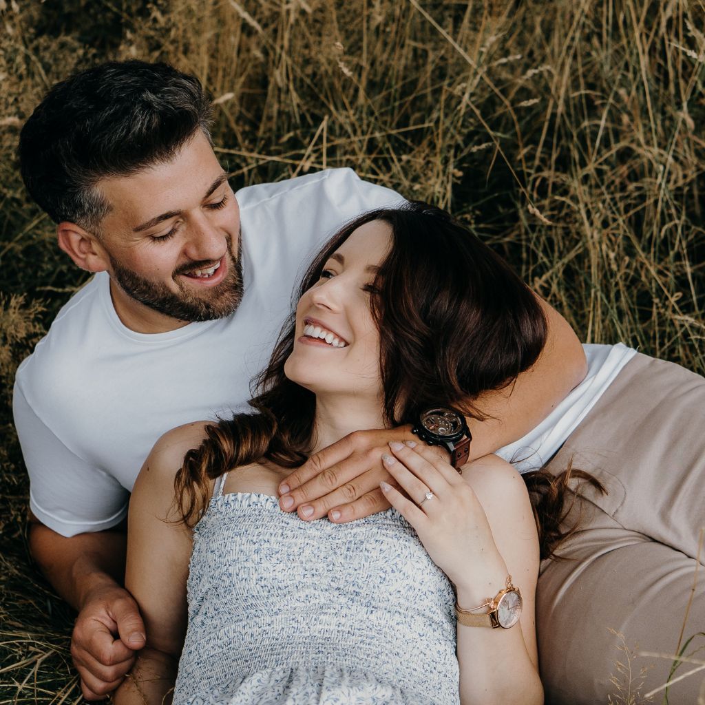 Happy couple smiling together outdoors