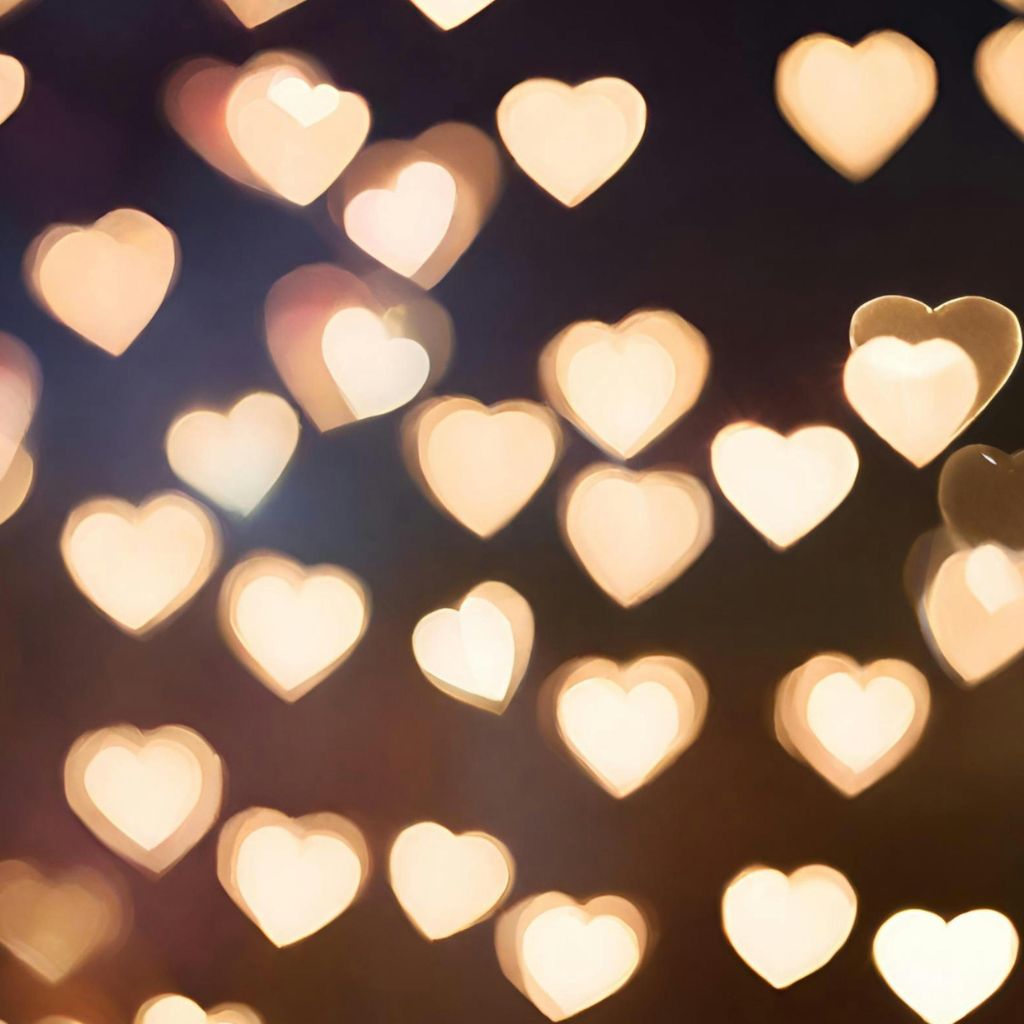 Glowing heart-shaped bokeh lights on a dark background