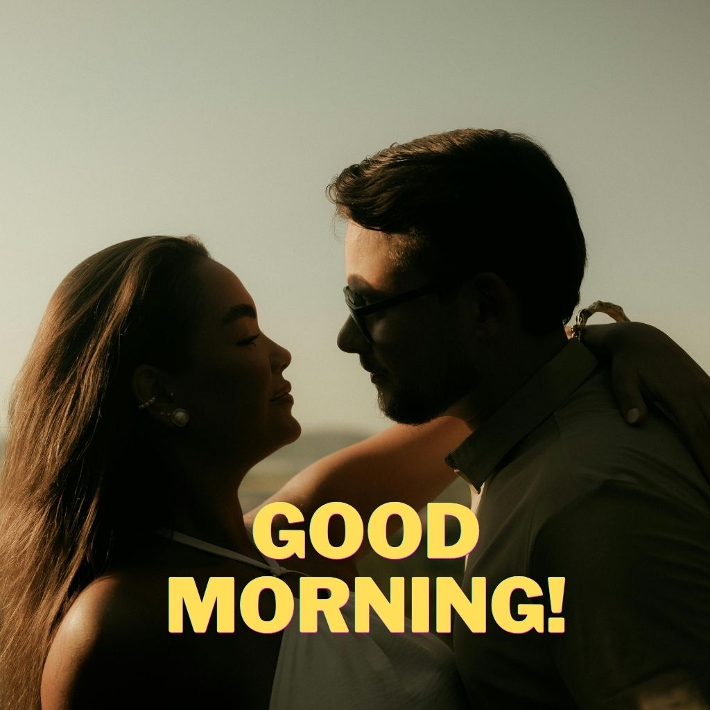 Good morning love image of a couple looking at each other in a warm romantic moment