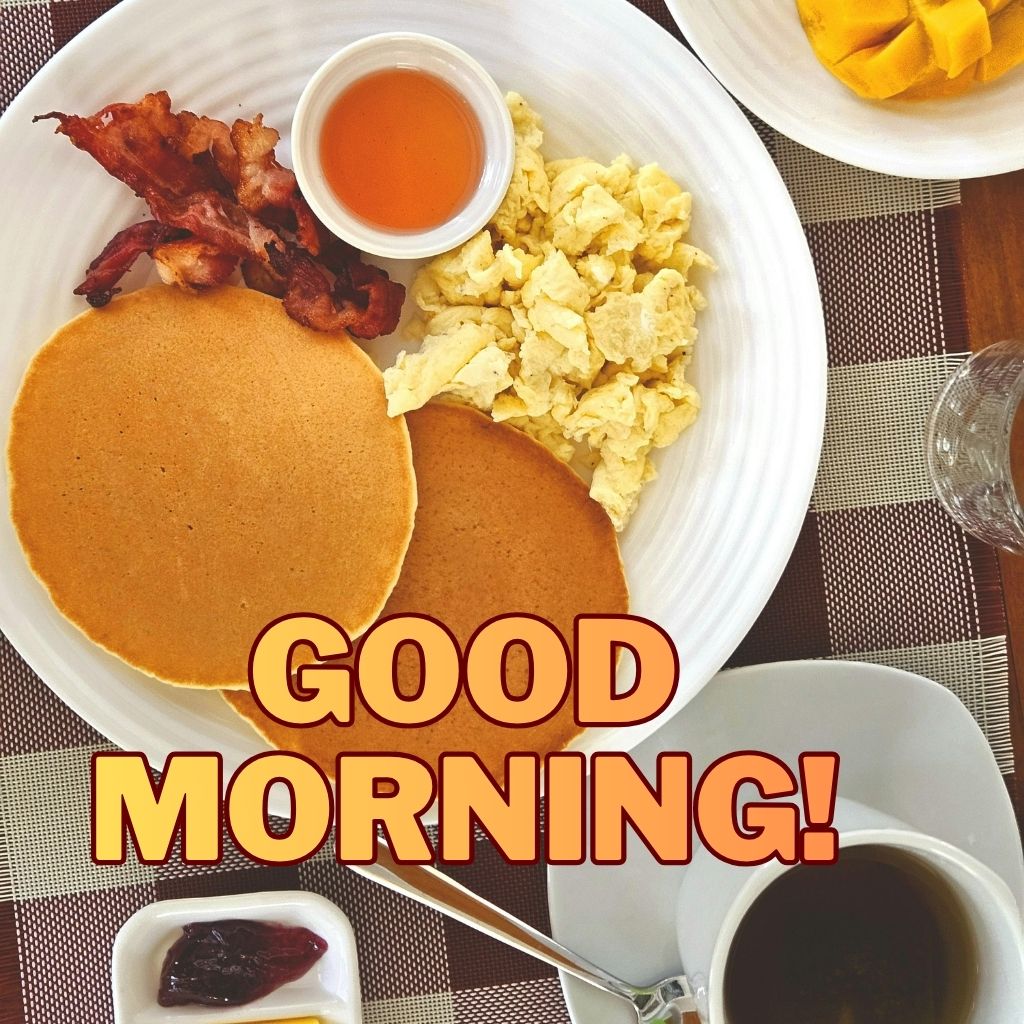 A top-down shot of a breakfast plate with pancakes, scrambled eggs, and bacon next to coffee with bold text reading "GOOD MORNING!".